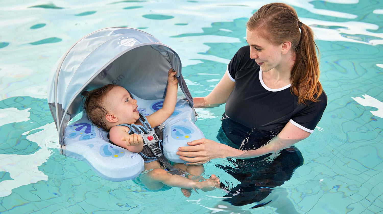 Mom and baby enjoying pool time with a Kiddiko baby swim float and sun canopy in South Africa