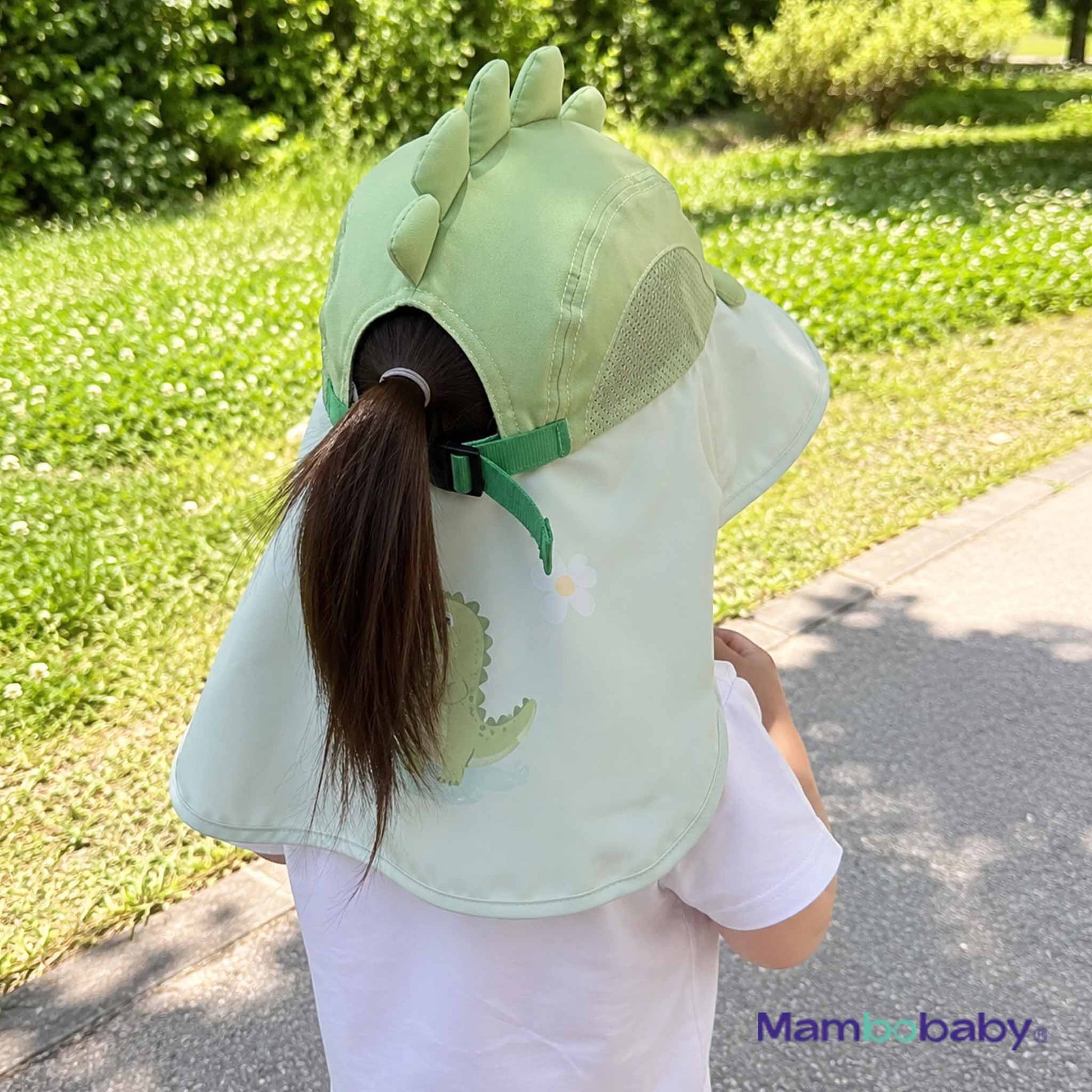 Child wearing Mambobaby Dino sun hat showing 360° neck coverage outdoors