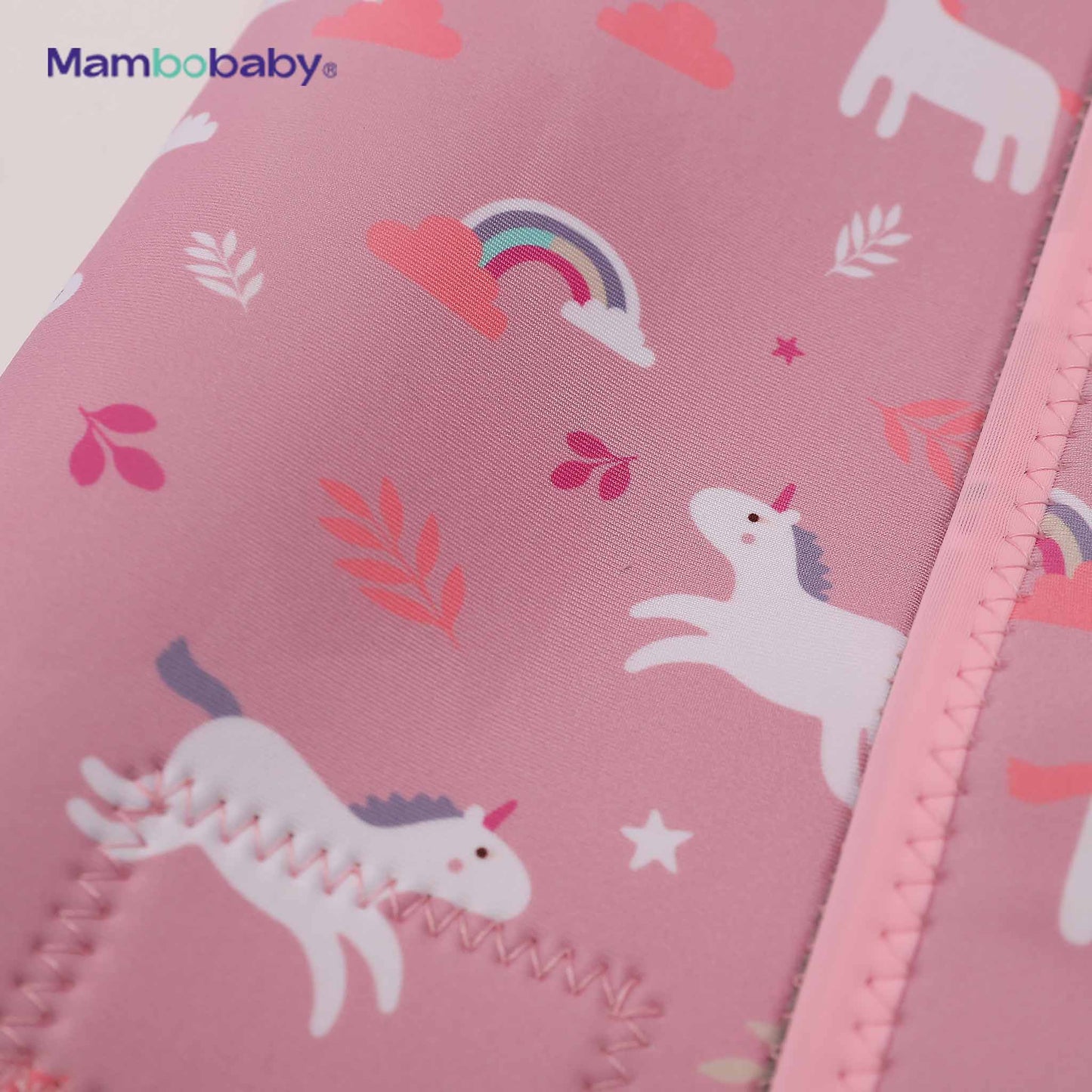 Close-up of unicorn and rainbow print detail on thermal wetsuit fabric