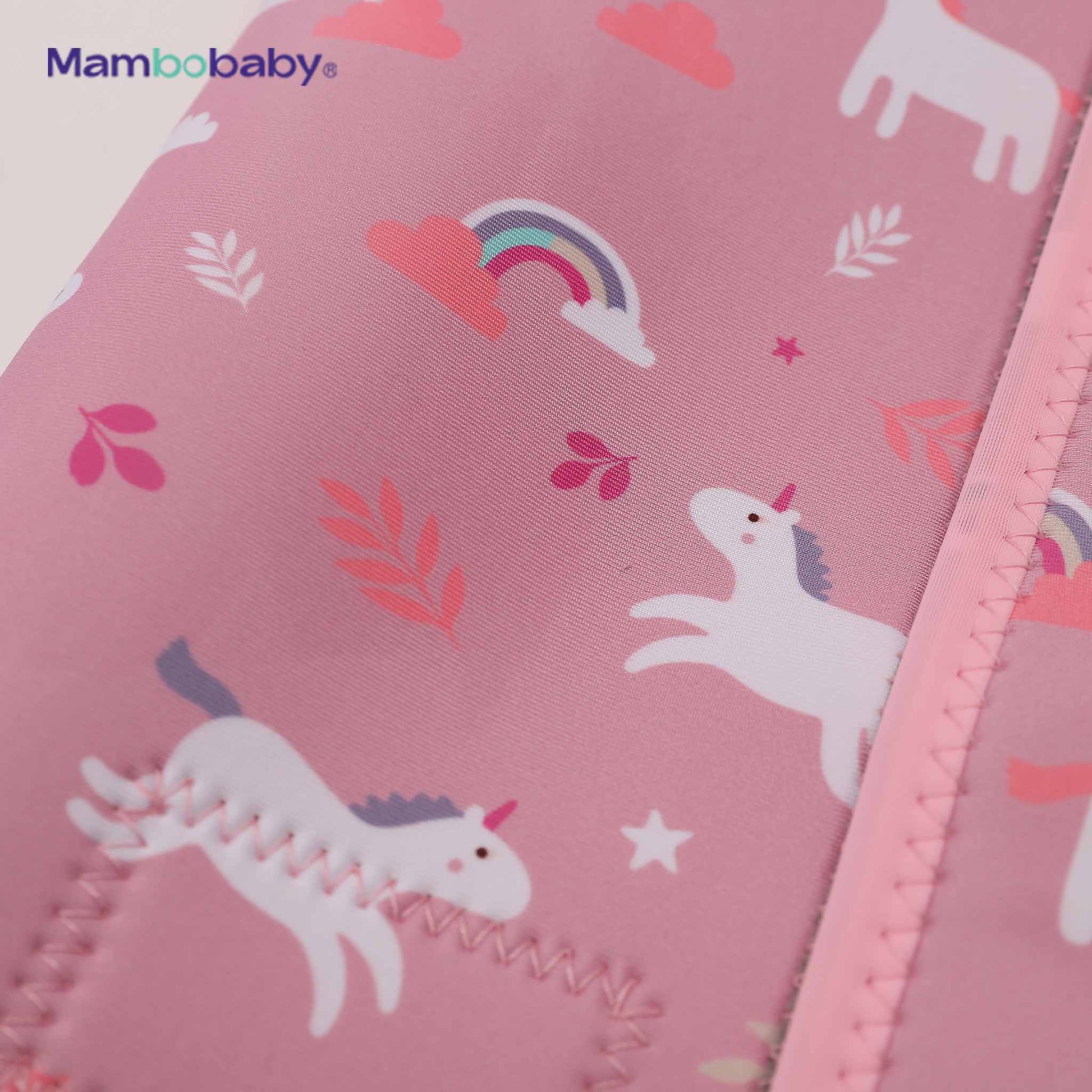 Close-up of unicorn and rainbow print detail on thermal wetsuit fabric
